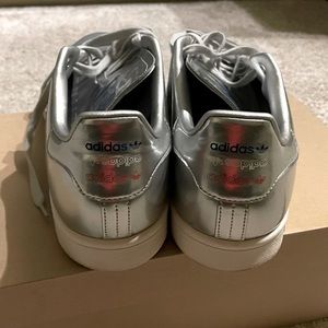 Gently used, size 12 metallic Adidas Stan Smith tennis shoes.